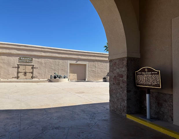 A snapshot of the arched entryway into the compound. The marker is under the roof, on the right side of the entrance. Marker text is in the body of this page.